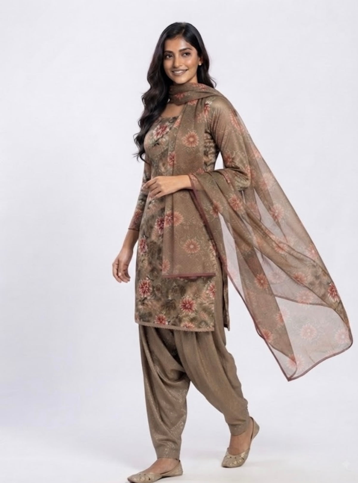 Rich brown salwar suit and warm earthy tones adorned with vibrant floral prints.