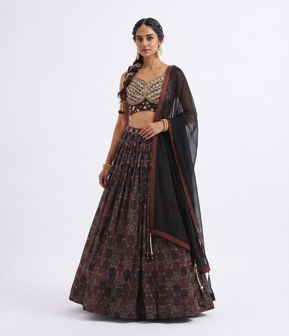 Traditional designer flared lehenga paired with a beautifully fitted sleeveless choli (blouse) and a graceful sheer dupatta.
