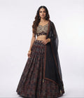 Traditional designer flared lehenga paired with a beautifully fitted sleeveless choli (blouse) and a graceful sheer dupatta.